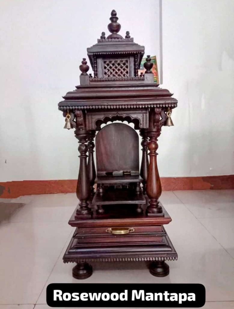Compact rosewood shrine with hanging bells and an arched sanctum