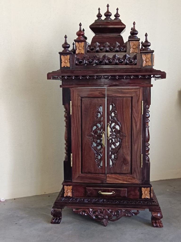 Rosewood cabinet with pale floral inlay on the crown and doors