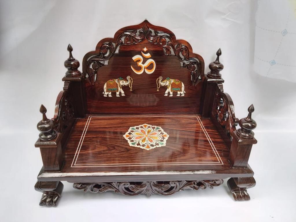 Low rosewood seat with an Om, two elephants, and a floral medallion