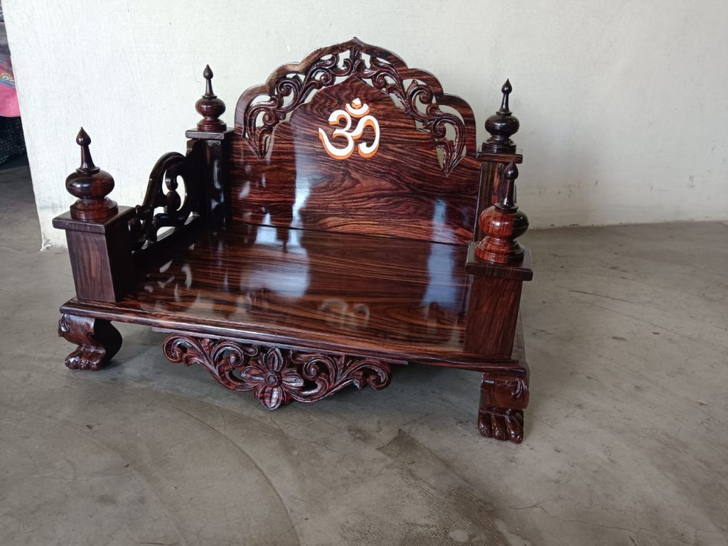 Broad rosewood seat with an Om set in a carved crest