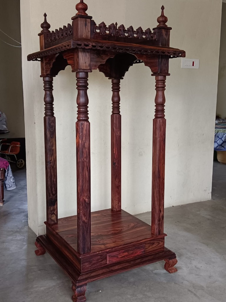 Tall open rosewood canopy with four long pillars and a carved eave